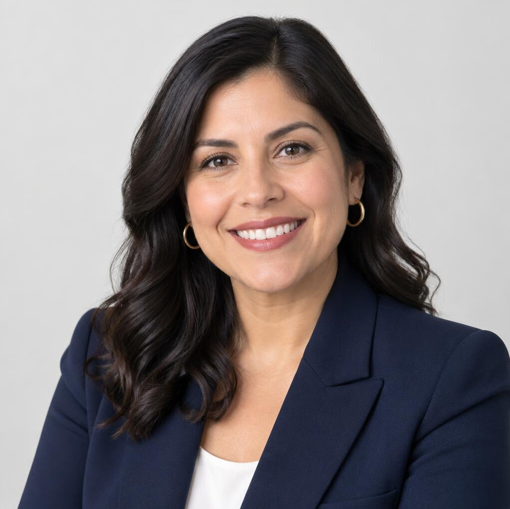 Portrait of a smiling Latina woman in a blazer